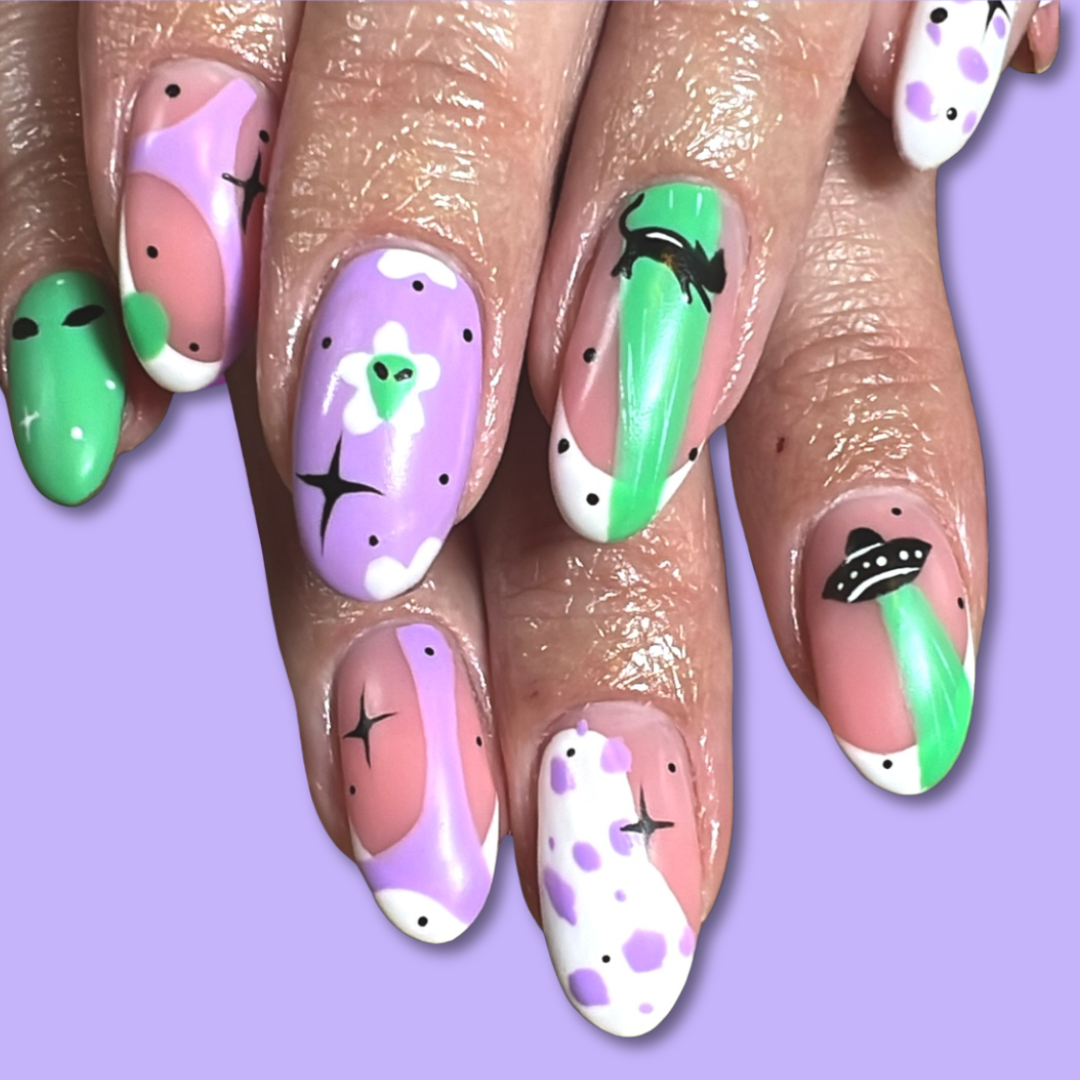 Press on false nails with alien and space inspired nail art in purple and green. bespoke press on nail set, made to size small, medium, large or bespoke nail sizes.